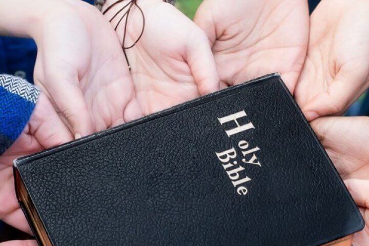 Youth Holding a Bible